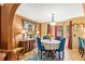 Charming dining room with a round table, blue chairs, and a decorative chandelier at 150 Wilbanks St, Buford, GA 30518