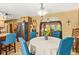 Bright dining area featuring a round table, blue chairs, and an open view to the living room at 150 Wilbanks St, Buford, GA 30518