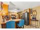 Cozy kitchen with breakfast bar seating and a stainless steel refrigerator at 150 Wilbanks St, Buford, GA 30518