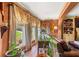 Bright living room with large windows, hardwood floors, and decorative curtains at 150 Wilbanks St, Buford, GA 30518