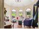 Inviting sun room with a dome ceiling, hardwood floors and lots of natural light at 150 Wilbanks St, Buford, GA 30518