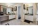 Bathroom featuring double vanities and a separate toilet room at 1592 Smithson Ct, Lithonia, GA 30058