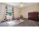 A bedroom with a table and chair set next to the window at 1592 Smithson Ct, Lithonia, GA 30058