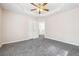 Bedroom with neutral walls, trey ceiling with fan, and two closets at 1592 Smithson Ct, Lithonia, GA 30058