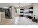 Dining room features black and white curtains and a modern chandelier at 1592 Smithson Ct, Lithonia, GA 30058