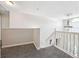Upstairs hallway features carpet and stairway at 1592 Smithson Ct, Lithonia, GA 30058
