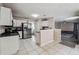 Open-concept kitchen boasts stainless steel appliances and access to additional living space at 1592 Smithson Ct, Lithonia, GA 30058