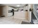 Spacious kitchen with granite countertops offers a functional layout and adjoins the staircase at 1592 Smithson Ct, Lithonia, GA 30058