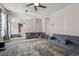 Living room offers plush carpeting, custom sofas and access to other parts of the home at 1592 Smithson Ct, Lithonia, GA 30058
