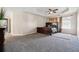 Main bedroom featuring neutral walls, trey ceiling, ceiling fan and gray carpet at 1592 Smithson Ct, Lithonia, GA 30058