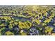 Expansive aerial view showcasing the home's neighborhood and golf course surrounded by lush greenery at 248 Montrose Dr, Mcdonough, GA 30253