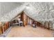Bright attic space with insulation, a wooden frame, and a carpeted floor at 248 Montrose Dr, Mcdonough, GA 30253
