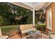 Relaxing back patio with comfortable seating, perfect for enjoying the serene outdoor ambiance and garden views at 248 Montrose Dr, Mcdonough, GA 30253