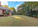 Lush backyard featuring mature trees and an expanse of green lawn at 248 Montrose Dr, Mcdonough, GA 30253