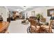Open basement space with a decorative fireplace, seating area, and a dining table with seating for four at 248 Montrose Dr, Mcdonough, GA 30253