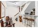 Finished basement with a bar, seating area, and staircase features neutral tile flooring and elegant decor at 248 Montrose Dr, Mcdonough, GA 30253