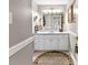 Bathroom with white cabinets, a large mirror, and ample counter space, perfect for getting ready at 248 Montrose Dr, Mcdonough, GA 30253