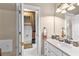 Bright bathroom with a granite vanity and an ornate shower curtain at 248 Montrose Dr, Mcdonough, GA 30253
