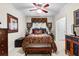 Bedroom with a decorative bedspread, window, and bedside tables with lamps at 248 Montrose Dr, Mcdonough, GA 30253