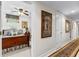 A comfortable bedroom is visible from the hallway, with a ceiling fan and natural light from the window at 248 Montrose Dr, Mcdonough, GA 30253