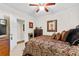 Bedroom with ceiling fan, dresser, and stylish bedding, creating a cozy atmosphere at 248 Montrose Dr, Mcdonough, GA 30253