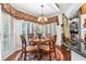 Charming dining area with a round table, bay window, and decorative chandelier at 248 Montrose Dr, Mcdonough, GA 30253