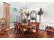 Charming dining area with large windows, plantation shutters, chandelier, and decorative accents at 248 Montrose Dr, Mcdonough, GA 30253