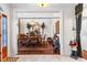 Formal dining room with classic furnishings, decorative mirror, and stately lion statue viewed from entryway at 248 Montrose Dr, Mcdonough, GA 30253