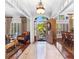 Inviting foyer showcasing elegant decor, a grand chandelier, and a view to the outdoors at 248 Montrose Dr, Mcdonough, GA 30253