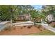 Charming red brick home featuring manicured landscaping, a winding driveway, and a welcoming entrance at 248 Montrose Dr, Mcdonough, GA 30253