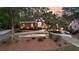 Beautifully landscaped red brick home featuring a circular driveway at 248 Montrose Dr, Mcdonough, GA 30253