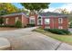 Beautiful brick home with a well-maintained lawn, complemented by lush landscaping and elegant architectural details at 248 Montrose Dr, Mcdonough, GA 30253