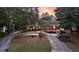 Beautifully landscaped brick home featuring a circular driveway at 248 Montrose Dr, Mcdonough, GA 30253
