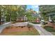 Beautiful red brick home featuring well-manicured landscaping and a long driveway at 248 Montrose Dr, Mcdonough, GA 30253