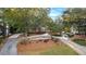 Exterior view of home with lush landscaping, mature trees, and inviting circular driveway at 248 Montrose Dr, Mcdonough, GA 30253