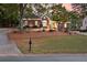 Charming brick home featuring mature landscaping, well-manicured lawn, and inviting entrance at 248 Montrose Dr, Mcdonough, GA 30253