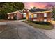 Beautiful brick home featuring a well-manicured lawn, mature trees, and an elegant driveway at 248 Montrose Dr, Mcdonough, GA 30253
