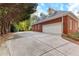 Brick home featuring a large two-car garage and an extensive concrete driveway at 248 Montrose Dr, Mcdonough, GA 30253