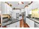 Spacious kitchen featuring white cabinetry, granite countertops, and stainless steel appliances at 248 Montrose Dr, Mcdonough, GA 30253