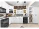 Bright kitchen features black appliances, white cabinets, and grey countertops at 248 Montrose Dr, Mcdonough, GA 30253