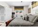 The comfortable Primary bedroom is decorated with a ceiling fan, neutral colors, and natural light at 248 Montrose Dr, Mcdonough, GA 30253