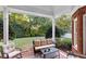 Relax on the covered patio with brick accents, perfect for outdoor seating and enjoying views of the well-maintained backyard at 248 Montrose Dr, Mcdonough, GA 30253