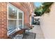 Cozy patio area with seating, accessible via a side pathway and featuring a table with chairs at 248 Montrose Dr, Mcdonough, GA 30253