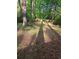 Tree-lined backyard providing a private, serene setting for outdoor enjoyment at 5582 Brady Dr, Stone Mountain, GA 30087