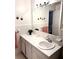 Bathroom with vanity, large mirror, and tiled walls creates a classic, bright space at 5582 Brady Dr, Stone Mountain, GA 30087