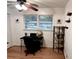 Bedroom with natural light, a ceiling fan, and functional desk and shelving at 5582 Brady Dr, Stone Mountain, GA 30087