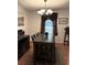 Cozy dining room featuring a rustic table, stylish lighting fixture, and warm, inviting decor at 5582 Brady Dr, Stone Mountain, GA 30087