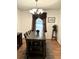 Elegant dining room featuring a rustic table, stylish lighting fixture, and cozy atmosphere at 5582 Brady Dr, Stone Mountain, GA 30087