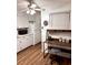Well-lit kitchen offering white cabinets, modern appliances, and a convenient workstation for organization at 5582 Brady Dr, Stone Mountain, GA 30087