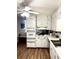 Bright kitchen offering white cabinets, modern appliances, and a seamless transition to the living area at 5582 Brady Dr, Stone Mountain, GA 30087